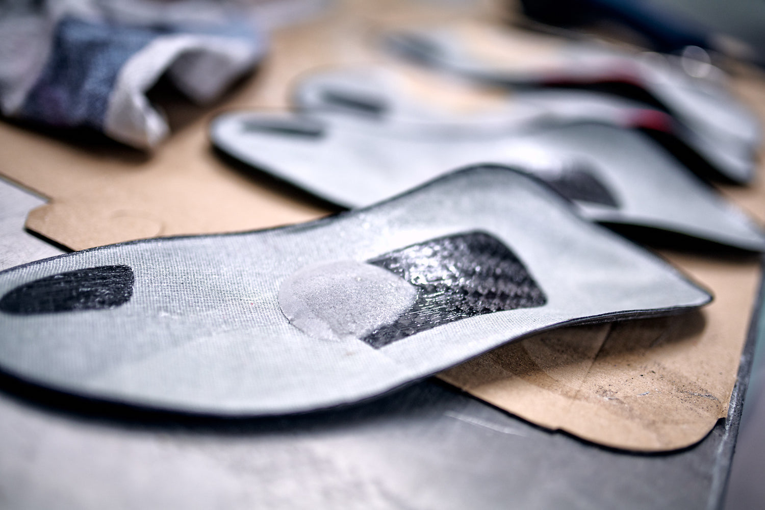 SOLESTAR insoles laying on a table and showing their build up-close.